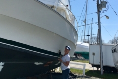 Waxing the hull.