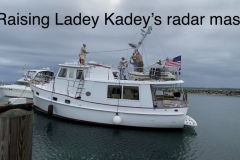 Raising the mast on Ladey Kadey.